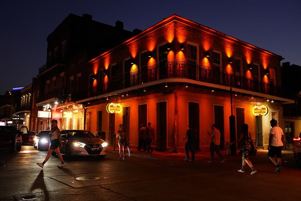People walk on Bourbon Street after Ida
